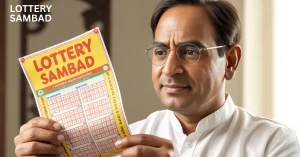 “Man wearing glasses reading a maharashtra lottery ticket, holding the colorful lottery slip close while looking focused indoors.”