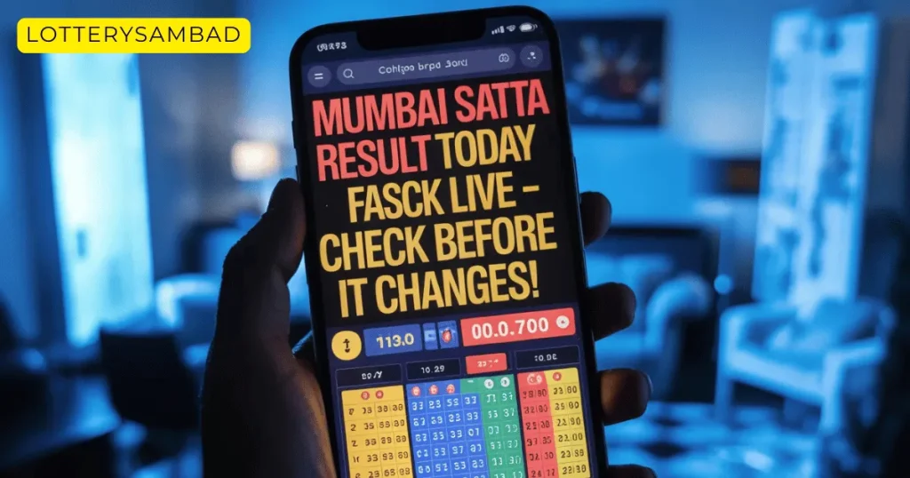 Alt text:
Hand holding a smartphone displaying a bold screen that reads “Mumbai Satta Result Today Live – Check Before It Changes!” with colorful number grids and figures below, and a small “Lotterysambad” label in the top left corner of the image; background shows a softly lit indoor room blurred in blue tones.
