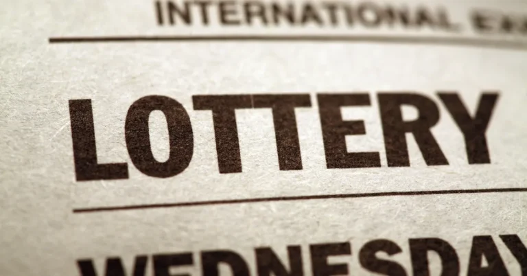 Lottery sambad 22 page showing the bold printed words "LOTTERY" and "WEDNESDAY" in large black text on aged paper
